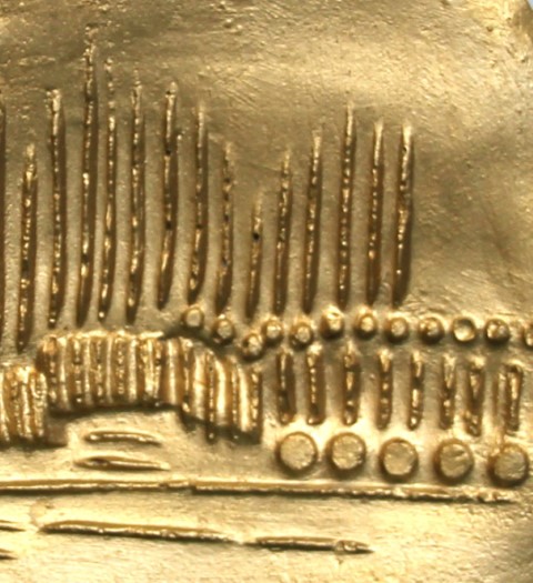 gold coin m1 in a frame closeup a